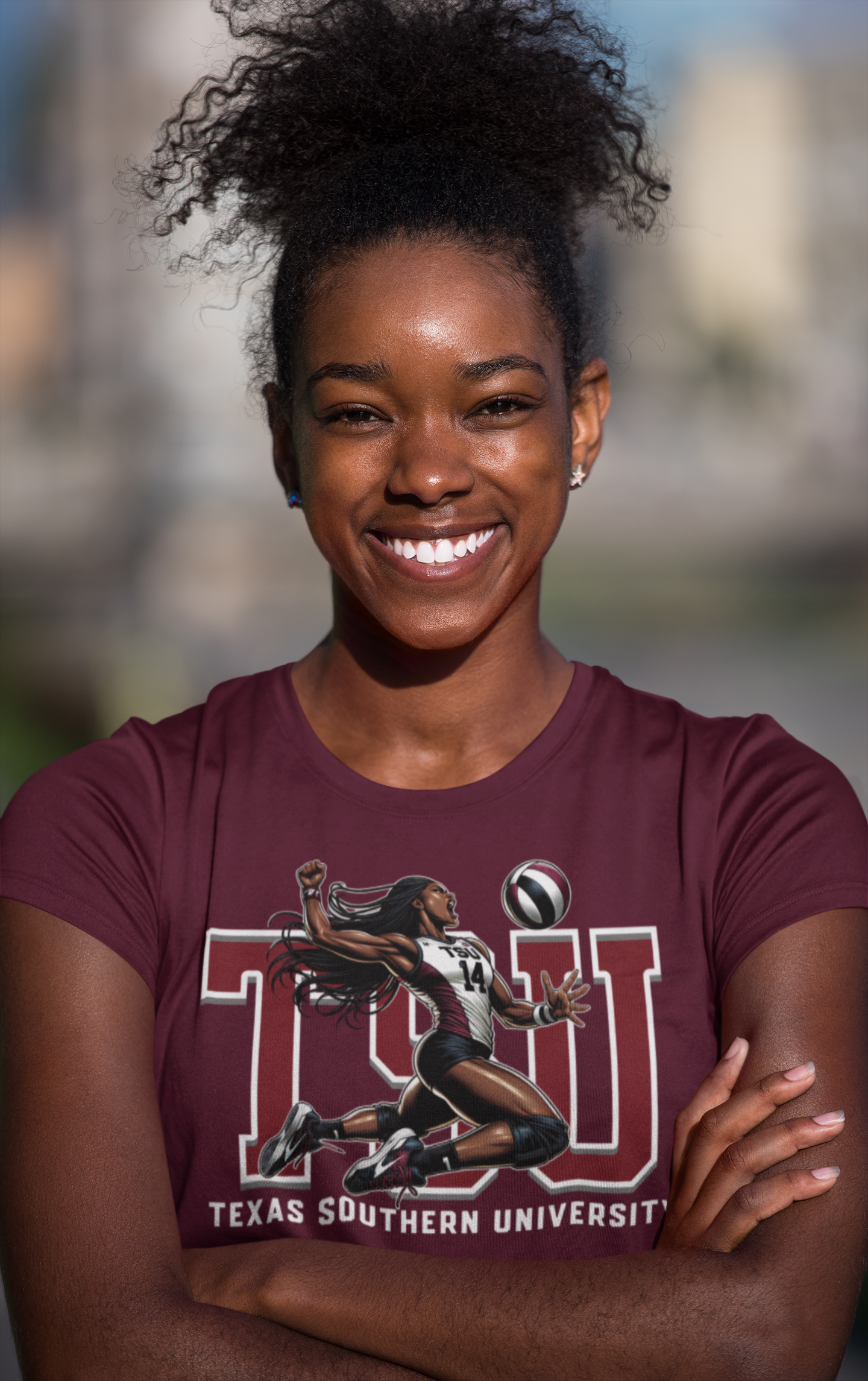 Woman wearing a Texas Southern University t-shirt with a graphic of a running track athlete.